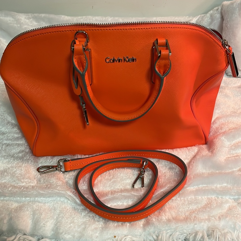 beautiful bag by Calvin Klein never used 14”Top 11”bottom6”width 9”heights bag